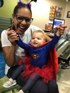 happy child hands in super costume halloween joyful doctor