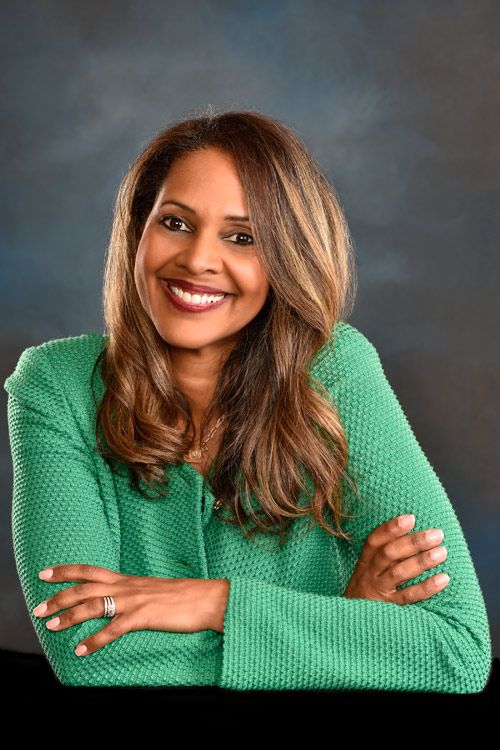 doctor siegel headshot blond hair green sweater smile