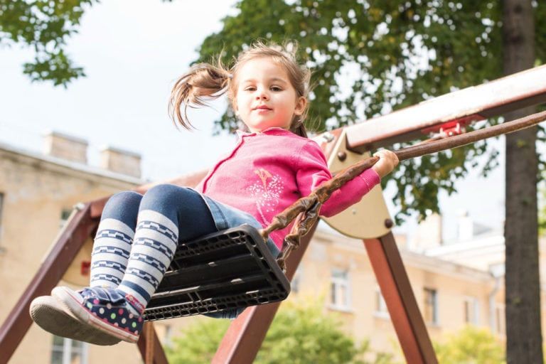 Kid on seesaw