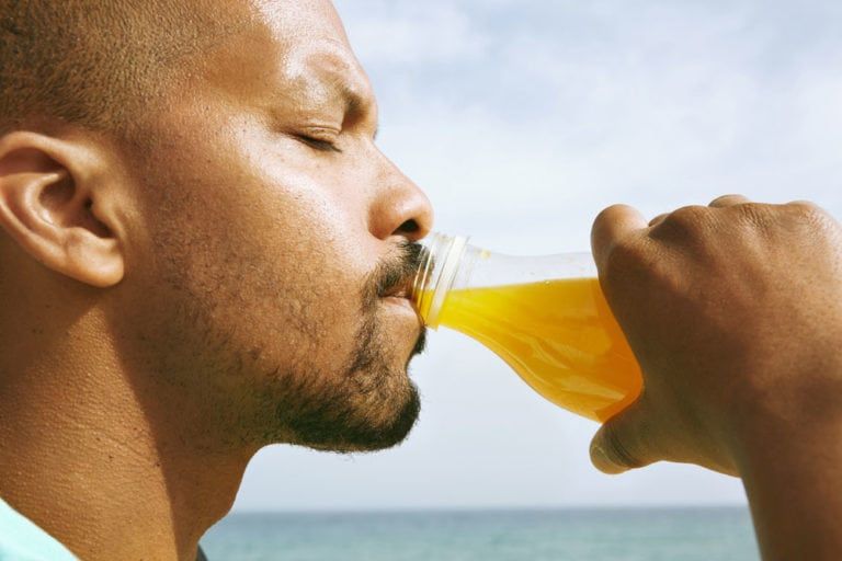 Black man drinking juice