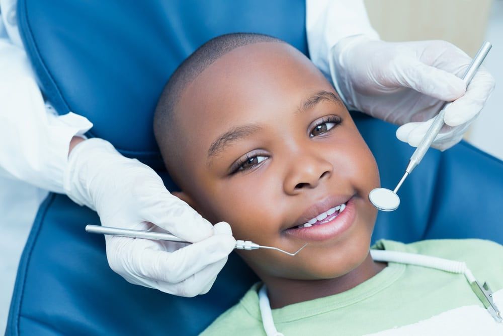 Small boy having dental checkup