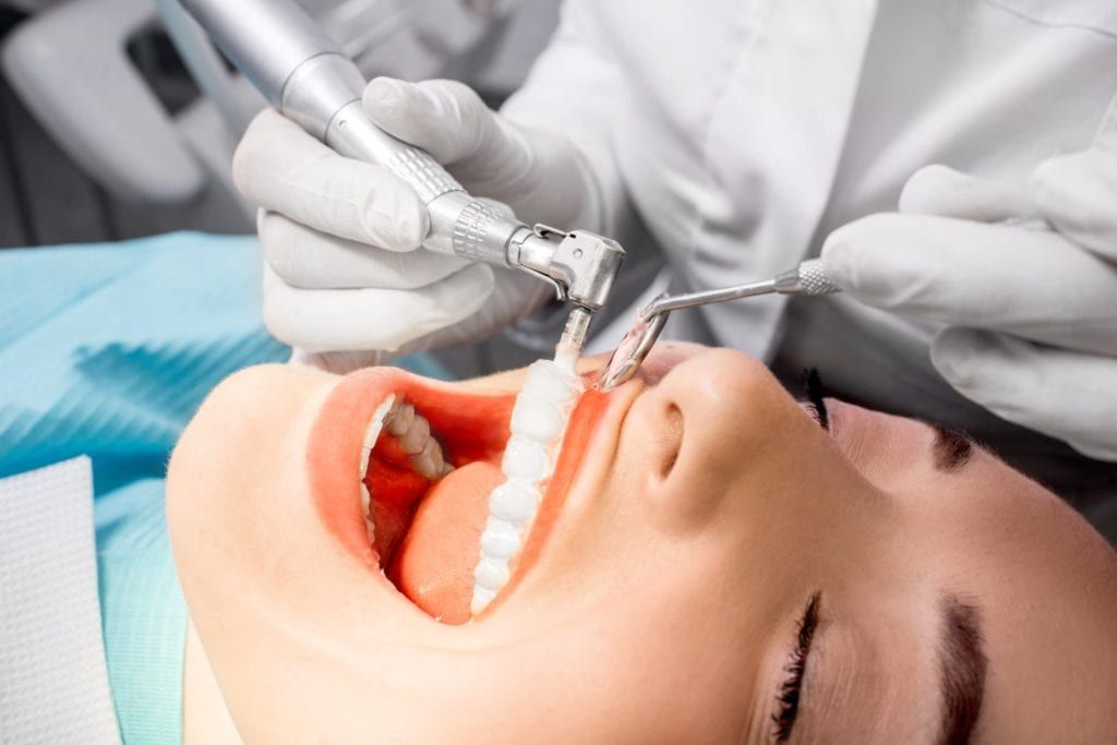 Woman having her teeth cleaned