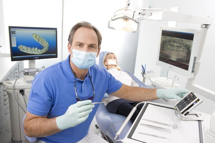 Dentist checking patient