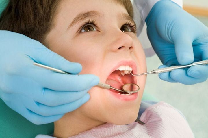 Small boy having dental checkup