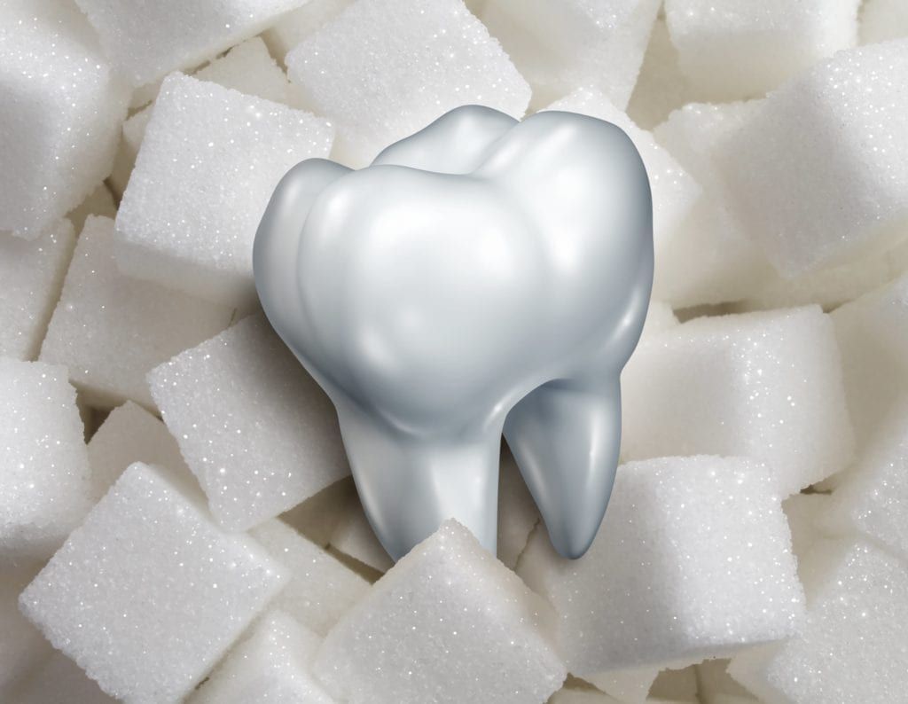 sugar cubes and tooth