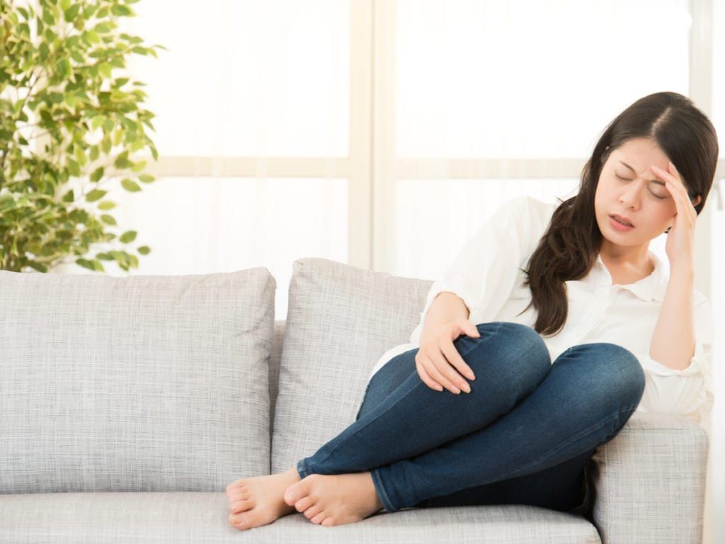 Woman experiencing chronic migraine