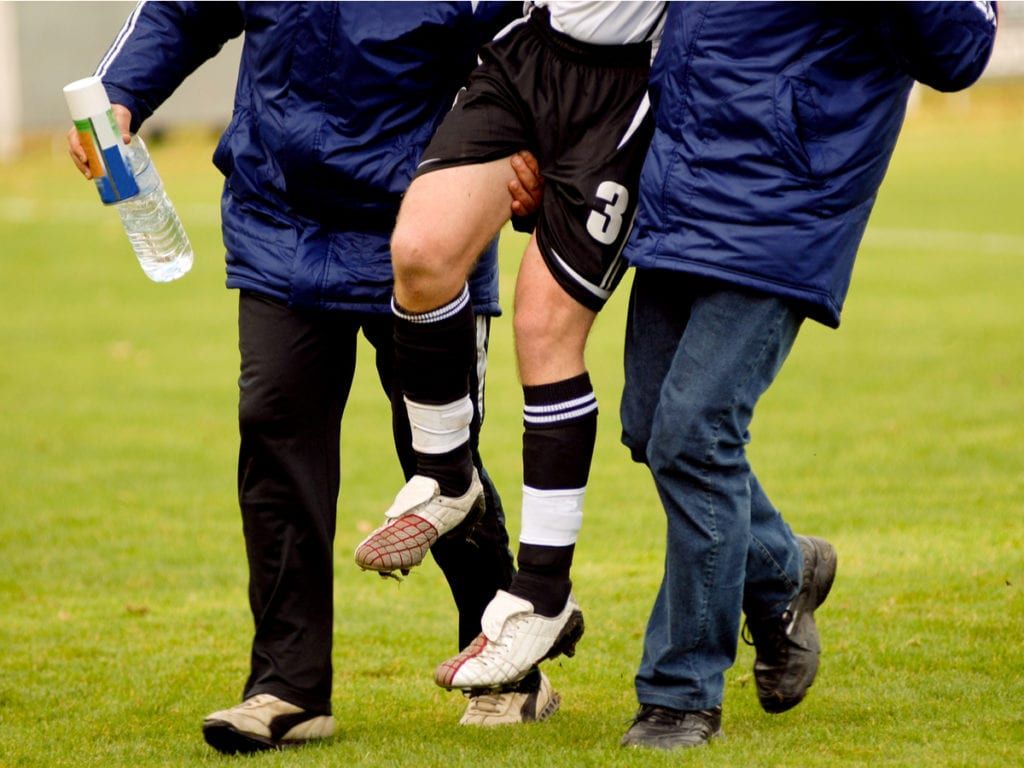Injured athlete being carried off field