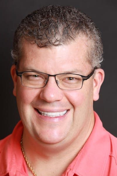 Man smiling after receiving TMJ treatment