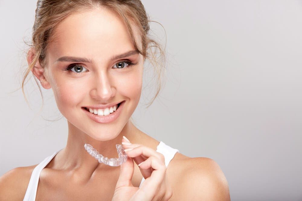 dental patient with Invisalign brace