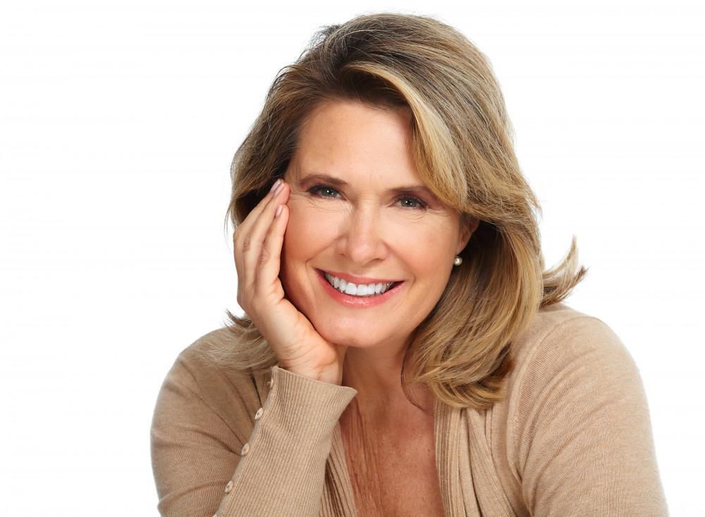 middle age caucasian woman smiling white background